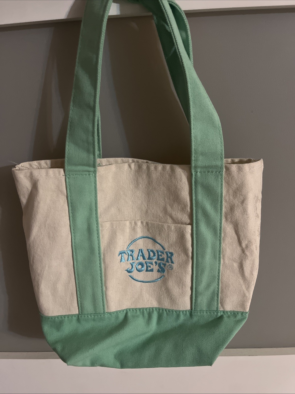 Authentic Trader Joe’s reusable tote bag featuring a stylish khaki background.