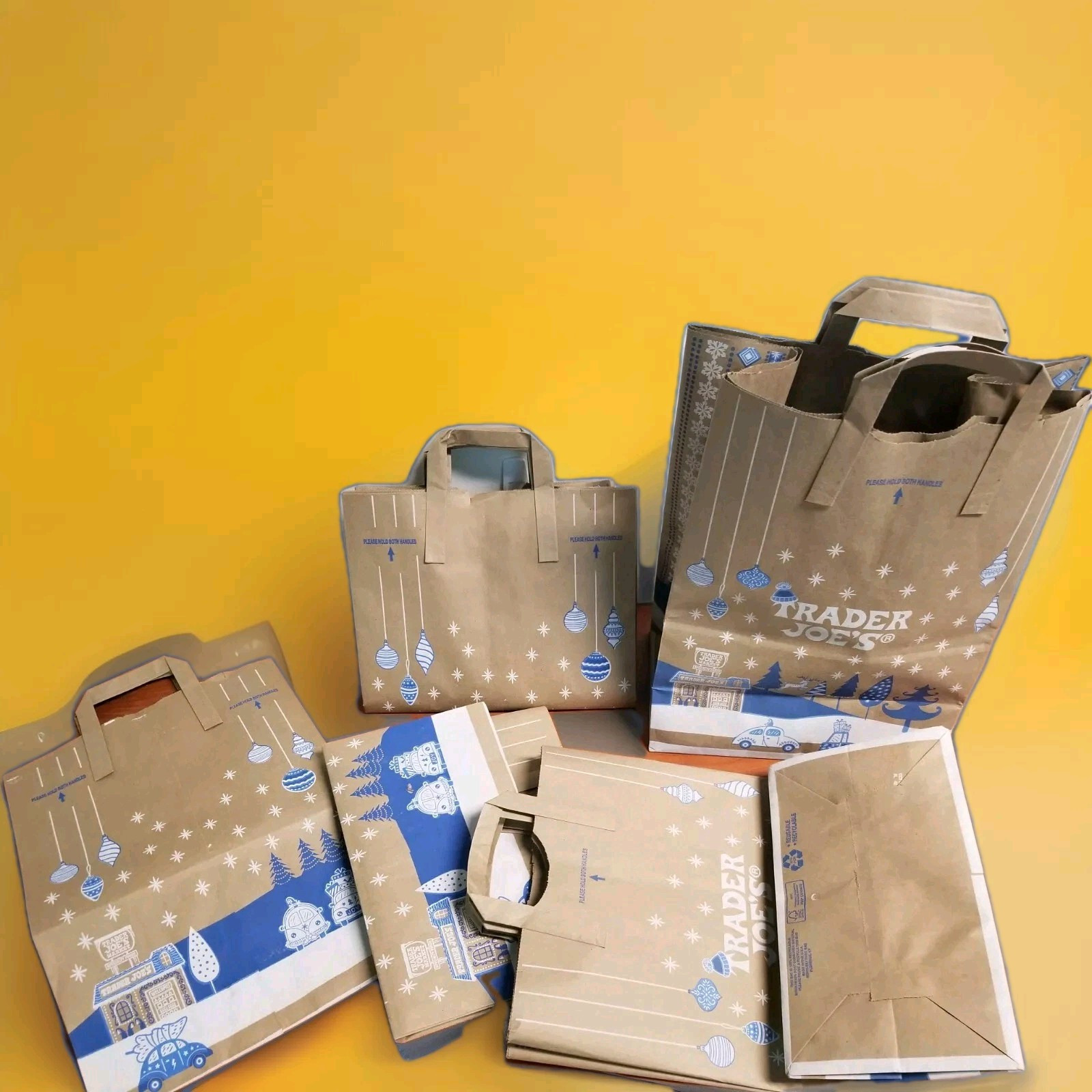Trader Joe’s: 2024 Holiday reusable paper grocery bags- (8) total bags in all.