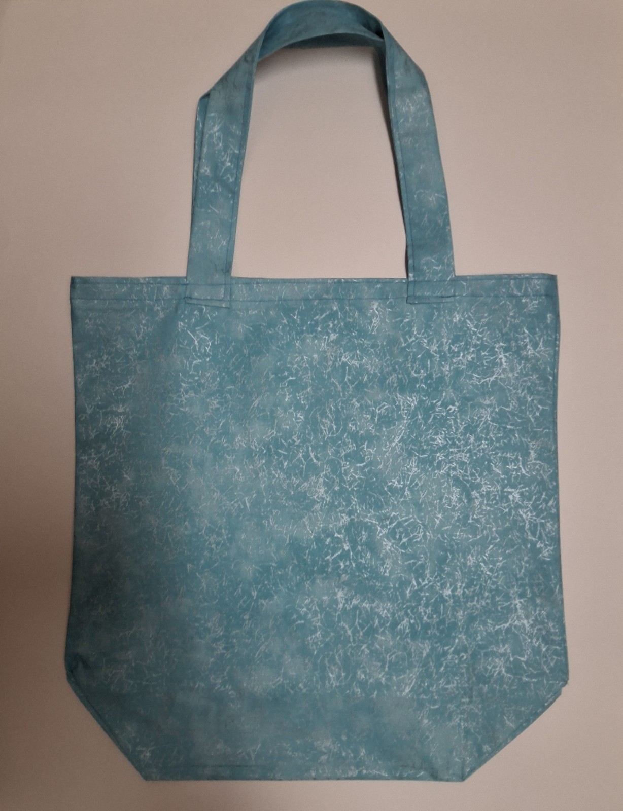 Blue and white reusable shopping bag with all-over pattern