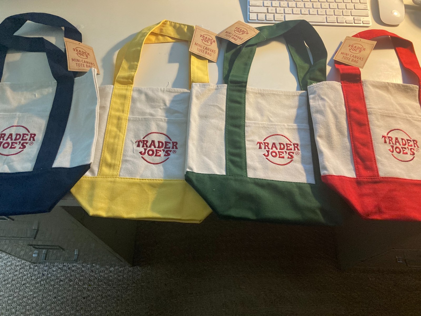 Traders Joes Canvas Tote Bags . Sold in set of 4 in Yellow, Red,Blue and Green