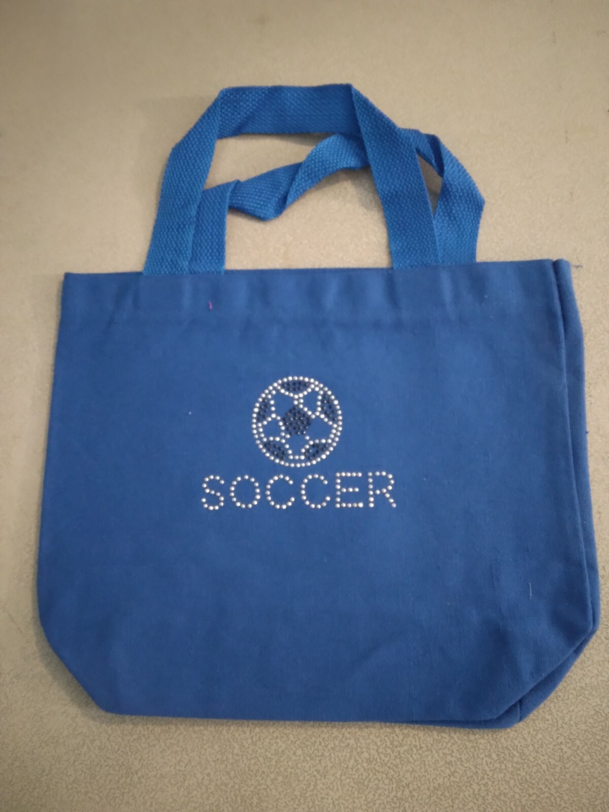 Blue bag with silver soccer ball 275555